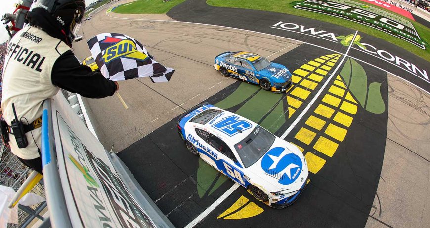 Ty Gibbs taking the Checkerd Flag at Iowa Speedway (Credit: NASCAR.com)