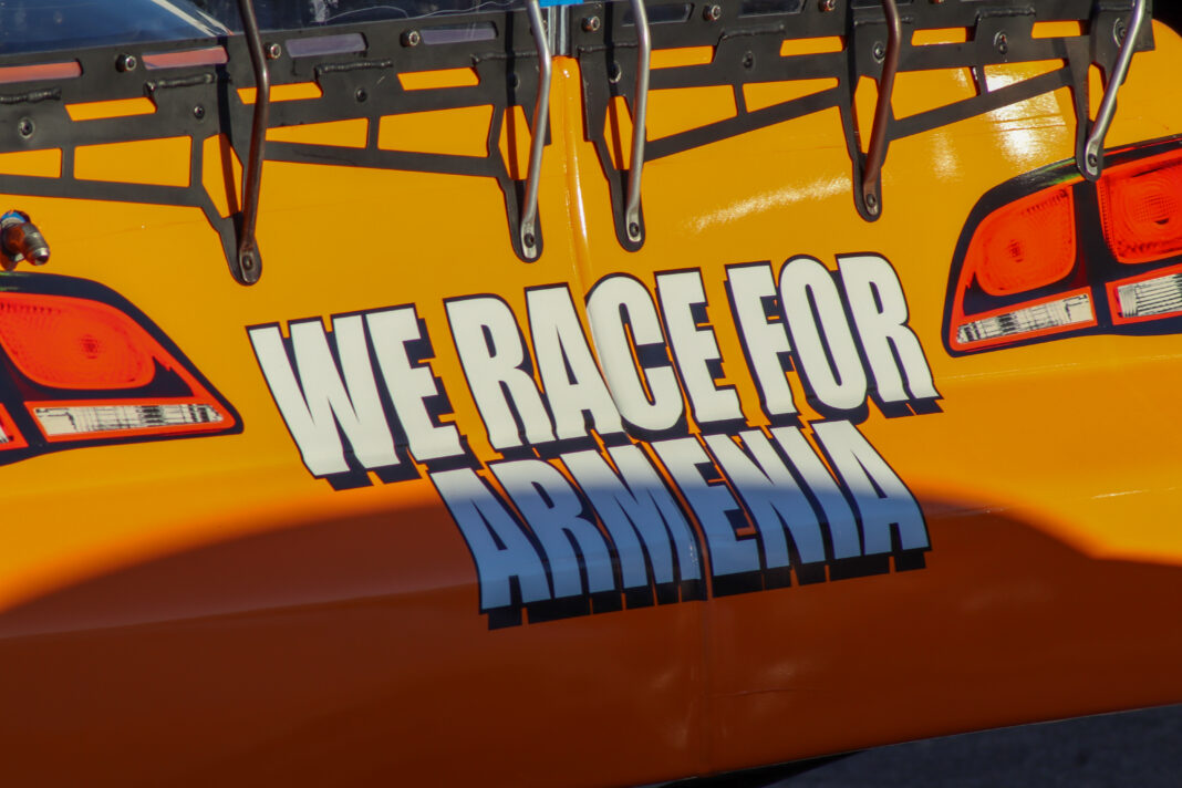 The back of Alex Eskandari’s GRT car features the phrase “We Race for Armenia.”